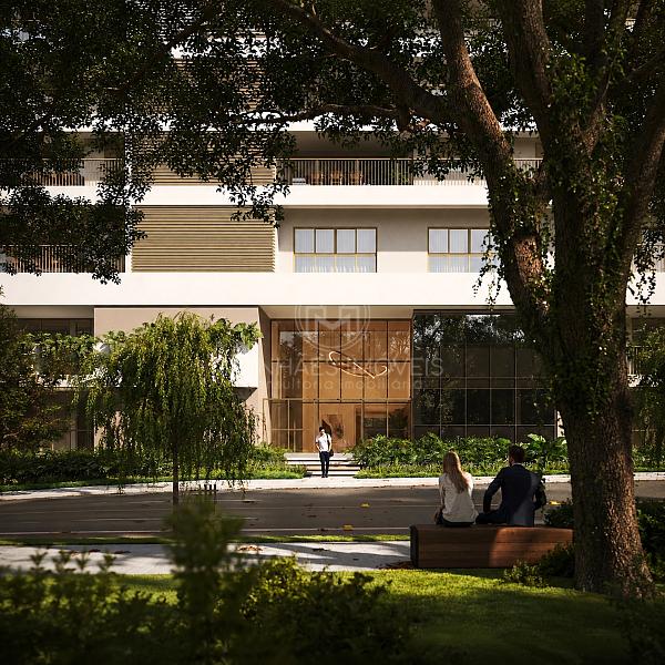 Fachada frontal contempor�nea do Aman vista atrav�s da pra�a arborizada 