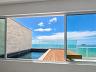 Living com vista mar