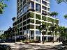 Fachada contempor�nea do edif�cio Cor� com embasamento envolto por jardins verticais e palmeiras