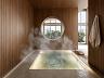Espa�o Wellness com Hydro Spa e sauna �mida com acabamento em madeira